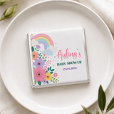 A personalized white chocolate bar wrapped in foil with colorful floral rainbow design for aisling baby shower mini neapolitan chocolates