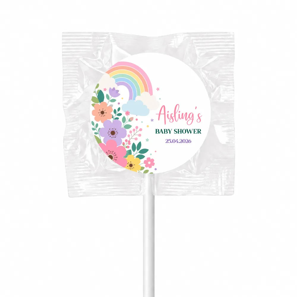 A colorful floral pastel rainbow swirl lollipop finished with a white stick wrapped in clear plastic for baby shower