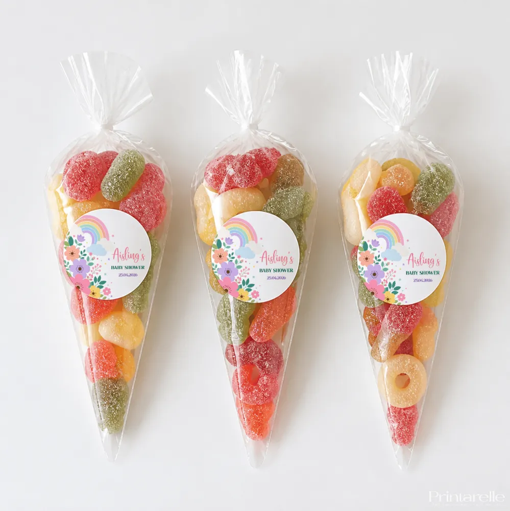 Three clear plastic sweet cones filled with colorful gummy candies perfect for rainbow blooms baby shower treats