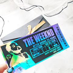Holographic concert ticket for The Weeknd with colorful design and text.
