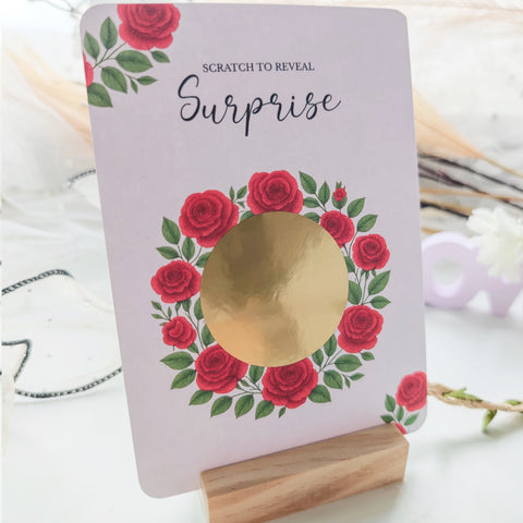 Gold scratch-off circle on rose design card
