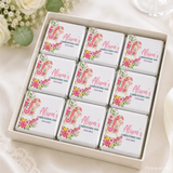 Pink and white floral rocking horse mini neapolitan chocolates arranged in a gift box for christening gifts
