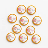 Pink rocking horse christening chocolate coins with floral designs and gold-rimmed edges party favor tokens