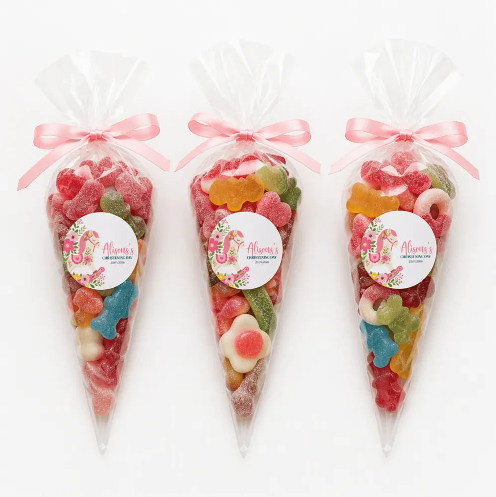 Three clear plastic sweet cones filled with colorful gummy candies tied with pink ribbons and rocking horse labels