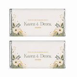 Two personalised 40g chocolate bars wrapped in silver foil with cream and gold floral labels for karen and dereks wedding