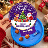 A festive purple and blue reindeer tub sticker with santa waves and a christmas scene for to and from labels