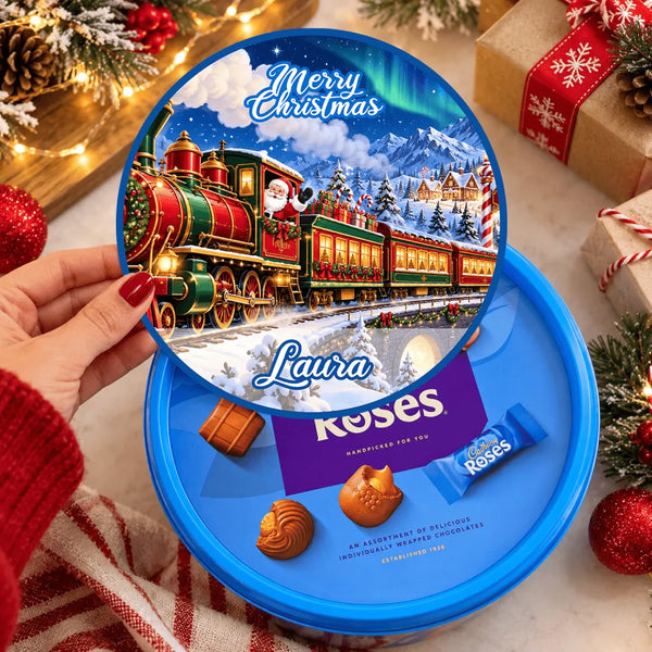 Blue circular laura roses christmas chocolates tub sticker with festive steam train loaded design for santa’s christmas train