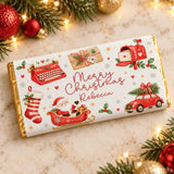 A festive red and white milk chocolate bar with retro typewriter design wrapped in gold foil for christmas fun