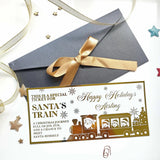 Gold foil santa train keepsake card with festive snowflakes and children on board for christmas surprise reveal