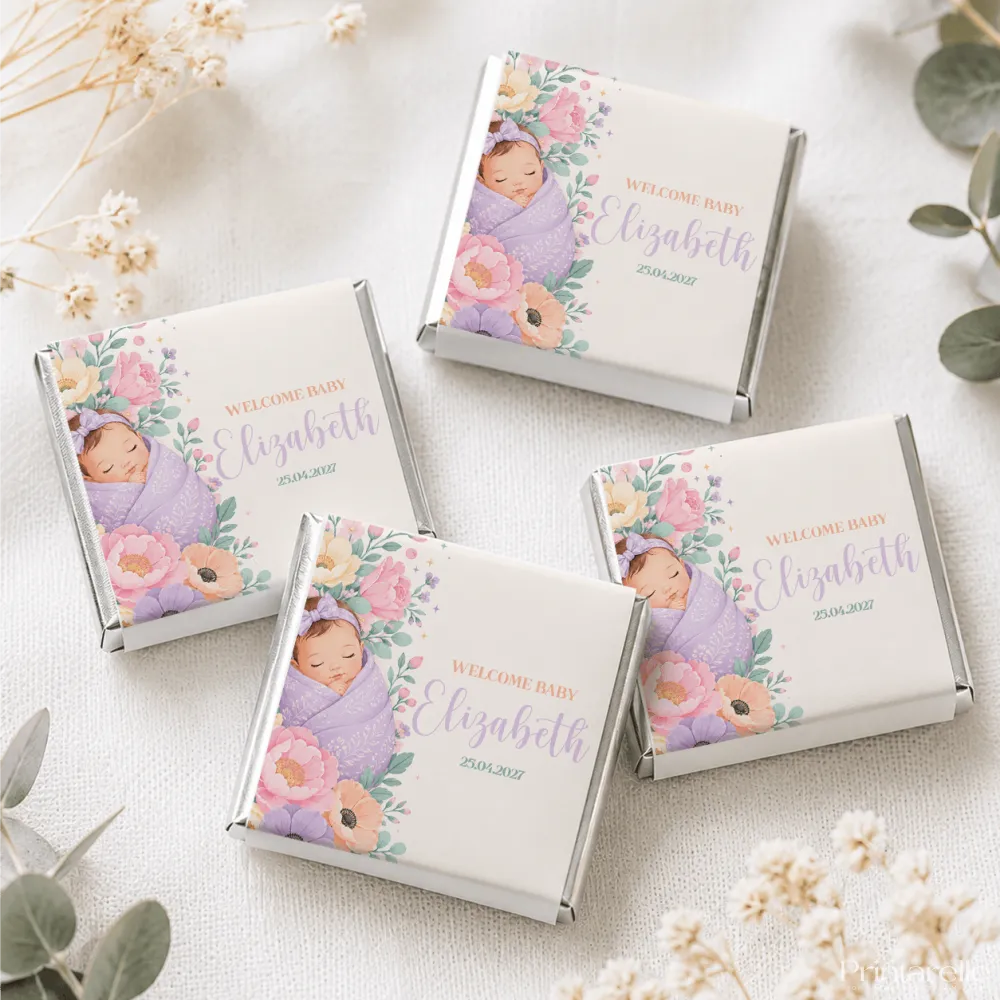 Square mini neapolitan chocolates with silver foil edges and a sleeping baby in lavender wrap and pink flowers design