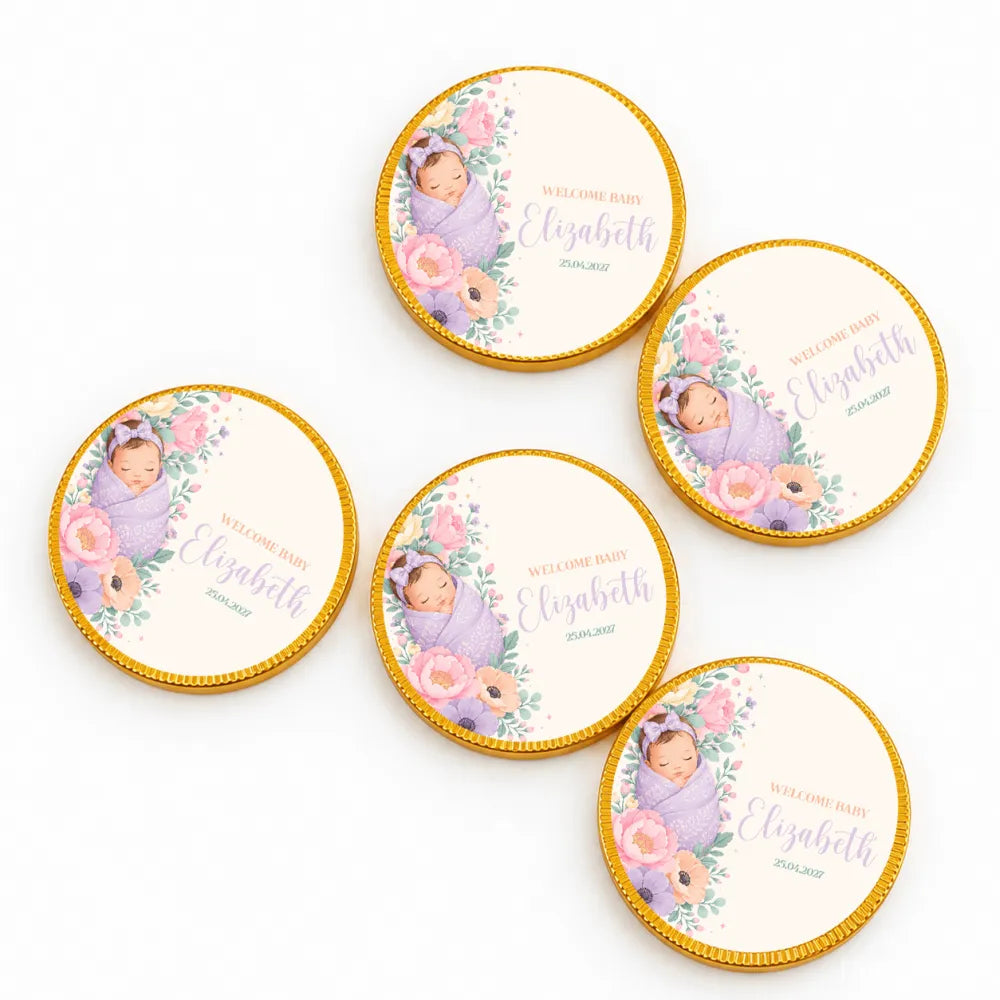 Round gold-edged 40mm milk chocolate coins with a printed sleeping baby wrapped in lavender fabric design