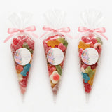Three clear plastic sweet cones filled sweet tied with pink ribbons and sleeping baby labels named elizabeth