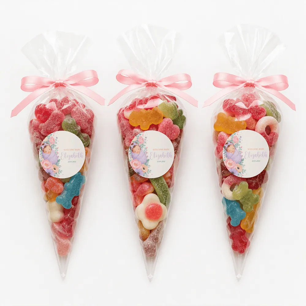 Three clear plastic sweet cones filled sweet tied with pink ribbons and sleeping baby labels named elizabeth