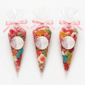 Three clear plastic sweet cones filled sweet tied with pink ribbons and sleeping baby labels named elizabeth
