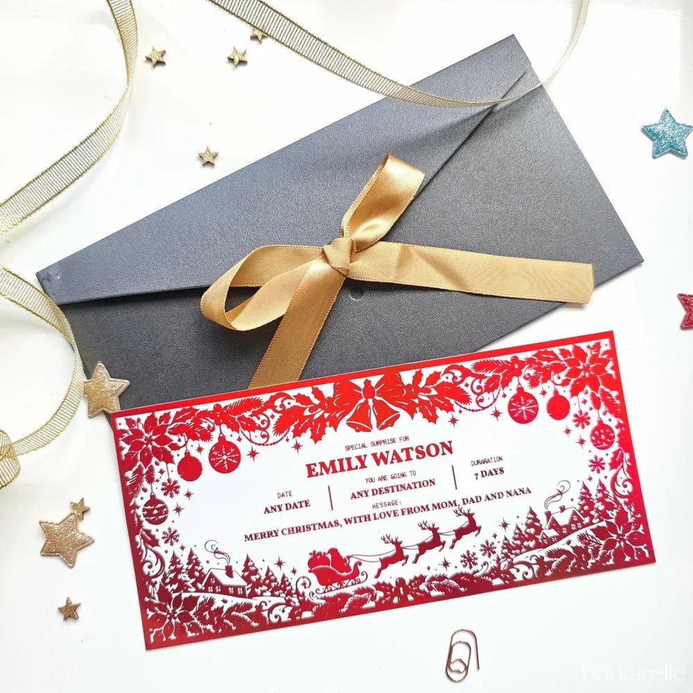 Red christmas holiday reveal card with intricate sleigh, ornament, and tree cut-outs for festive surprise reveal