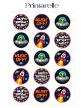 Space aliens birthday cupcake toppers with cartoon rockets and green aliens on purple icing sheet wafer paper