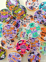 Colorful circular halloween-themed coasters with playful pumpkins ghosts bats and cute animals for 40mm milk chocolate coins