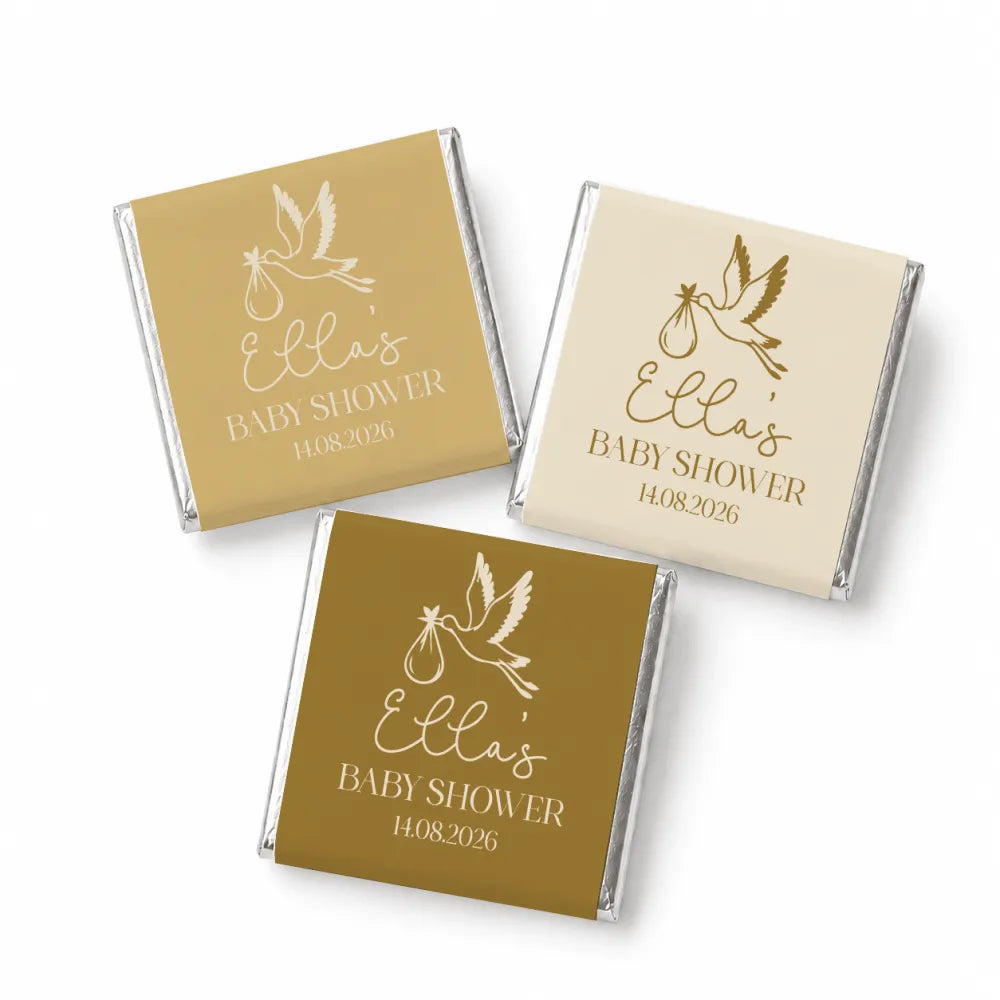 Gold and cream baby shower mini neapolitan chocolates wrapped in silver foil with white and gold dove design