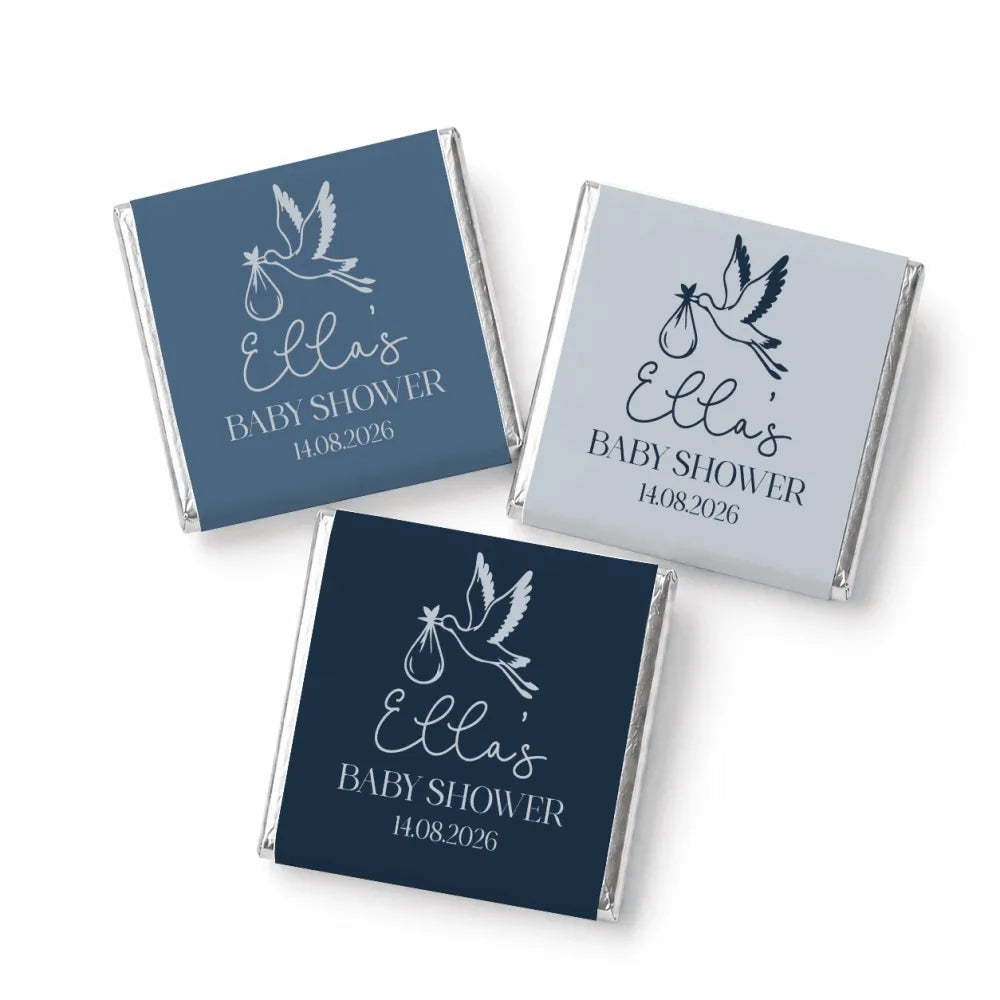 Three foil wrapped mini neapolitan chocolates with stork design for ellas baby shower favors in navy and gray colors