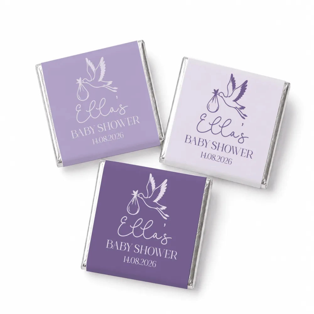 Lavender and white foil-wrapped mini neapolitan chocolates with stork design for ellas baby shower favors