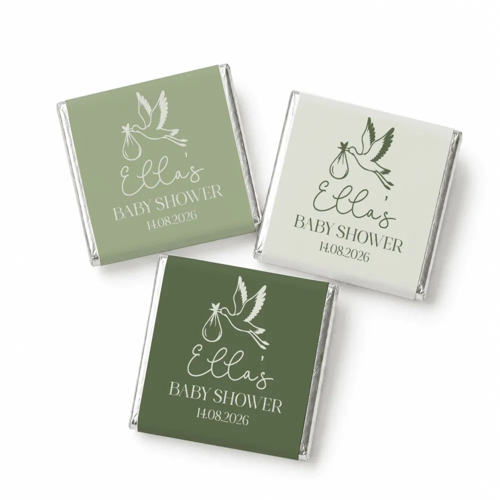 Three mini neapolitan chocolates wrapped in matte green and off-white foil with stork design for ella baby shower