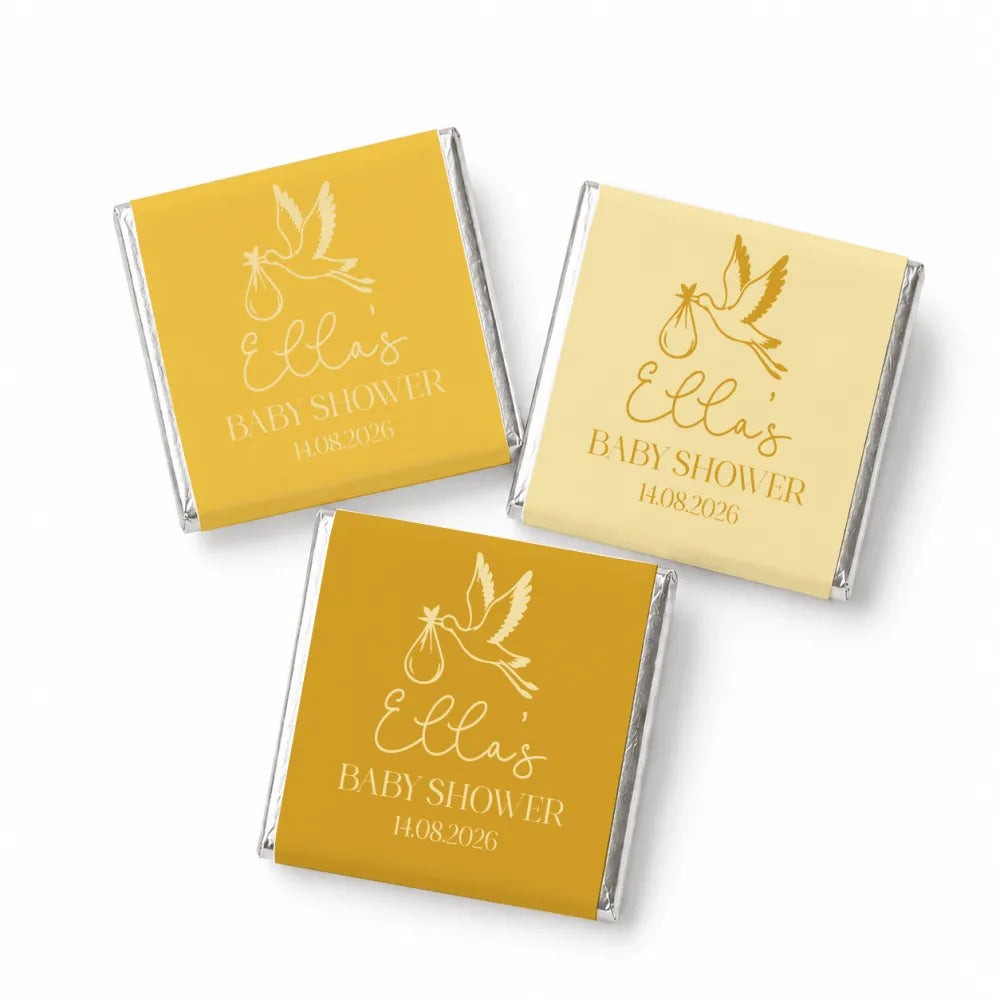 Gold foil wrapped mini neapolitan chocolates with white stork design and personalized text for ella’s baby shower favors