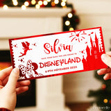 Red and white Disneyland ticket with castle and fairy design held by hands against a blurred festive background.
