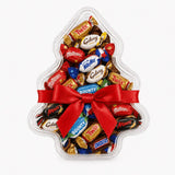 Clear tree shaped christmas tree favour box filled with candies tied with red ribbon and personalised sticker