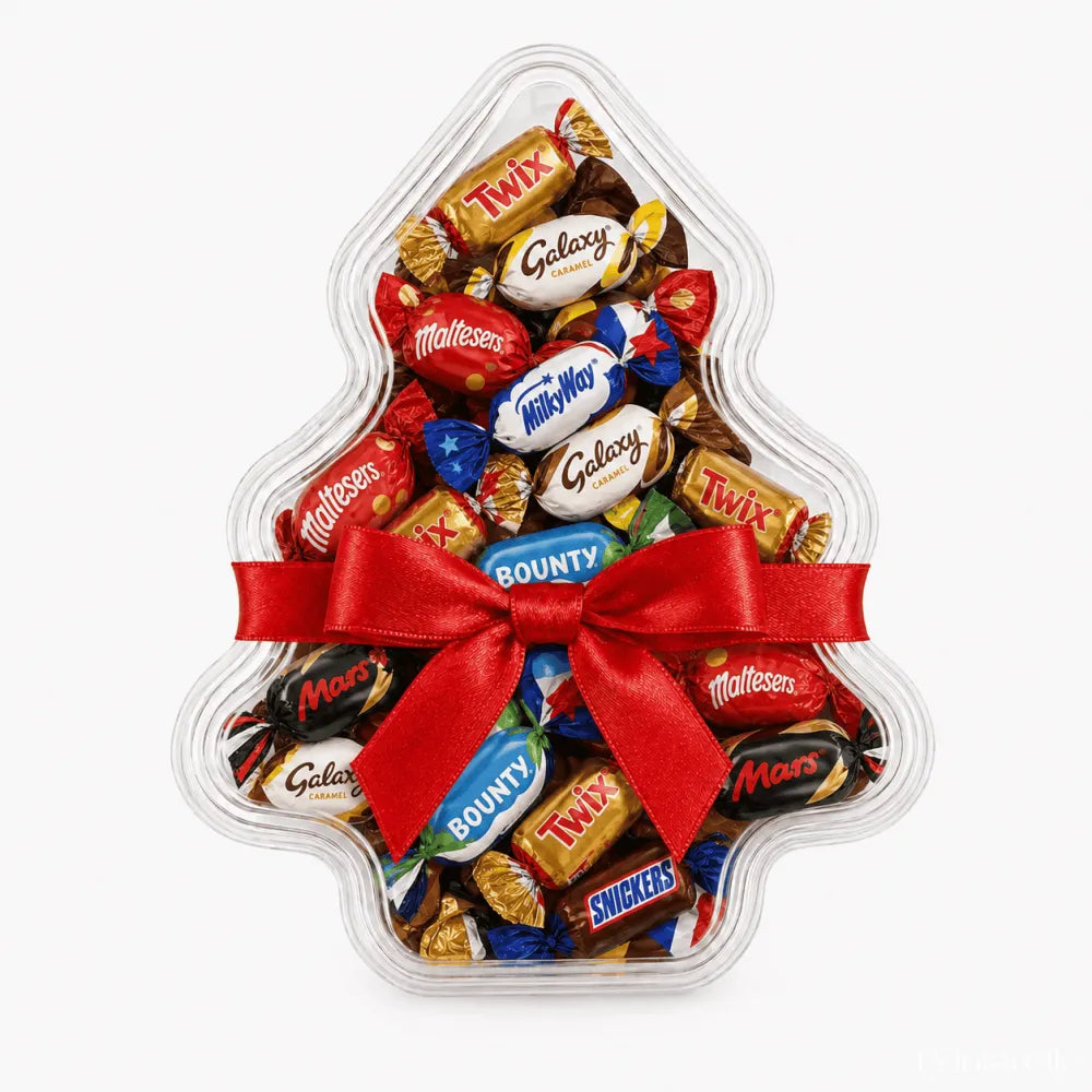 Clear tree shaped christmas tree favour box filled with candies tied with red ribbon and personalised sticker