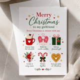 A white girlfriend christmas card with festive illustrations and merry christmas to my girlfriend text in red and green