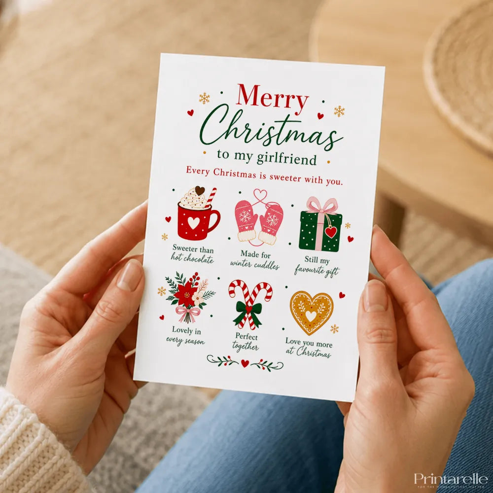 A white girlfriend christmas card with red and green text featuring hot chocolate mittens gift candy canes and heart ornament