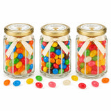 Three hexagonal glass jars with gold lids and cream ribbons filled with jelly beans and personalised 48mm pale gold sticker