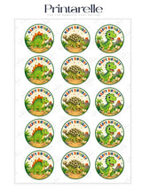 Circular edible cupcake toppers with green brown and yellow cartoon t-rex dinosaurs on a white background
