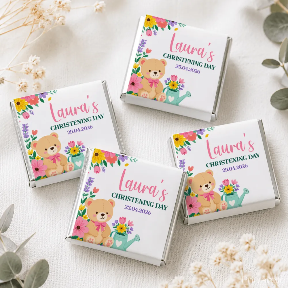 Personalized white chocolate mini neapolitan chocolates with floral and teddy bear designs wrapped in silver foil edges
