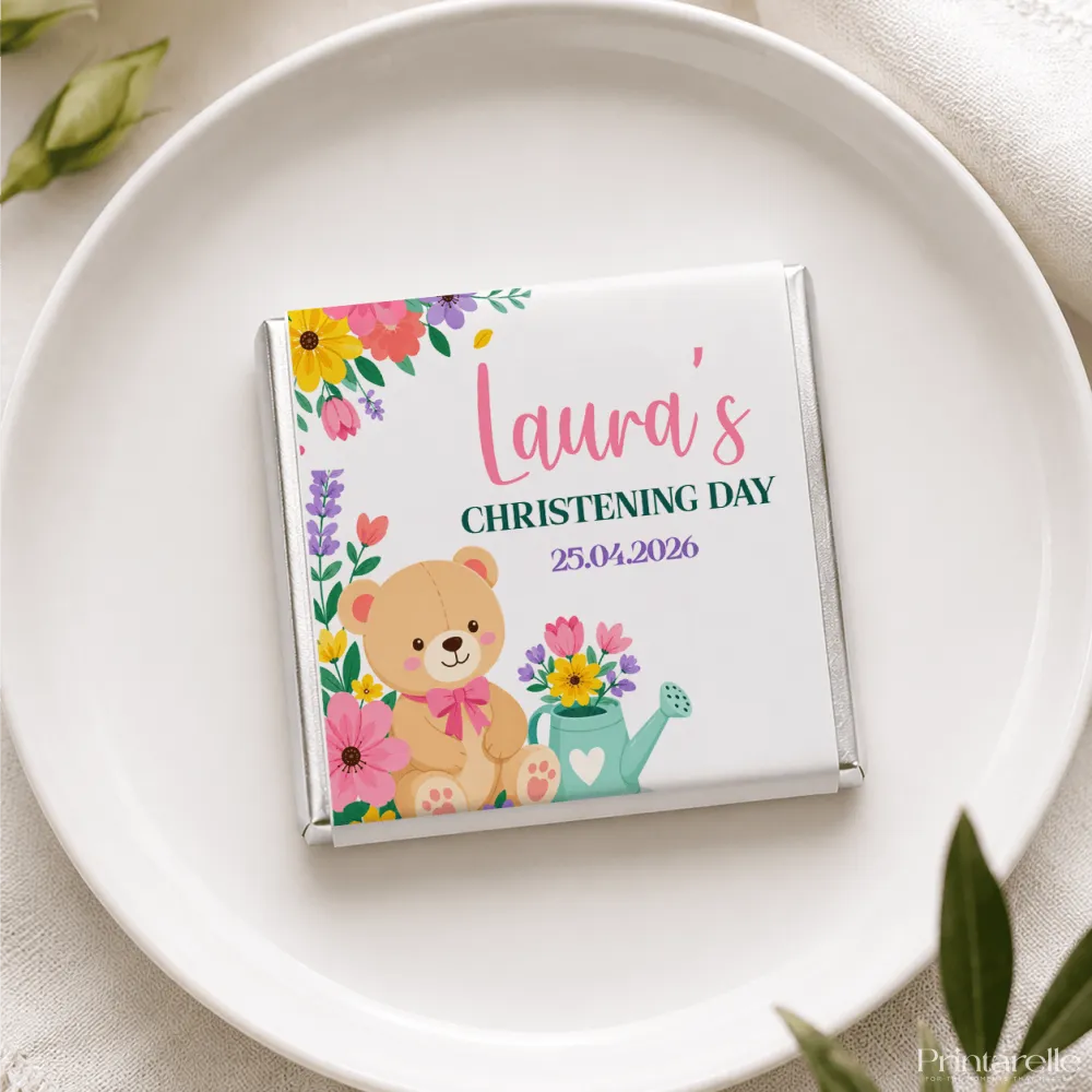 A white chocolate bar in a colorful floral wrapper with teddy bear design from teddy garden mini neapolitan chocolates