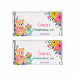 Two personalized 40g chocolate bars wrapped in silver foil with teddy bear labels for lauras christening day