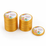 Golden chocolate coins with a cute teddy bear and floral design personalised for lauras christening day