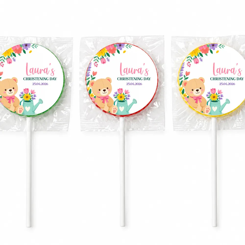 Three personalized swirl lollipops with teddy bear holding watering can and flowers for lauras christening day favor