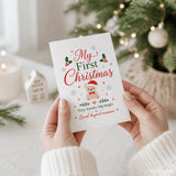 A white tiny hands big magic christmas card with festive holly hearts and teddy first christmas text in red and green