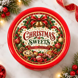 Red circular tin of traditional christmas sweets featuring mince pie and spiced orange slice festive holiday design