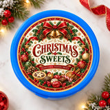 Blue plastic mince pie tub with festive red gold and green label featuring christmas sweets and spiced orange slice
