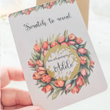Tulip-themed scratch reveal card with gold sticker