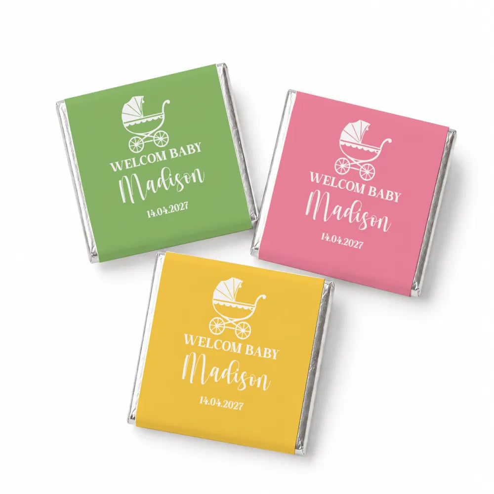 Three mini neapolitan chocolates wrapped in green pink and yellow foil with vintage pram designs for baby favours