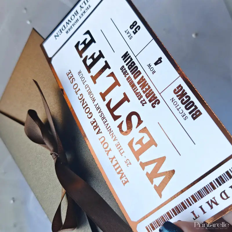 Ticket-style gift box with 'Westley' branding and a brown ribbon.