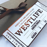 Ticket-style invitation for Westlife concert with brown ribbon