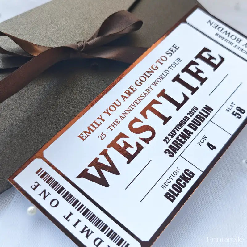 Ticket-style invitation for Westlife concert with brown ribbon