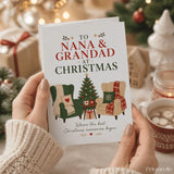 A white christmas card featuring a decorated tree and two armchairs with blankets for nana and grandad christmas card