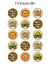 Circular safari-themed birthday cupcake toppers with cartoon lions, binoculars, and giraffe patterns in earth tones for personalised wild first birthday