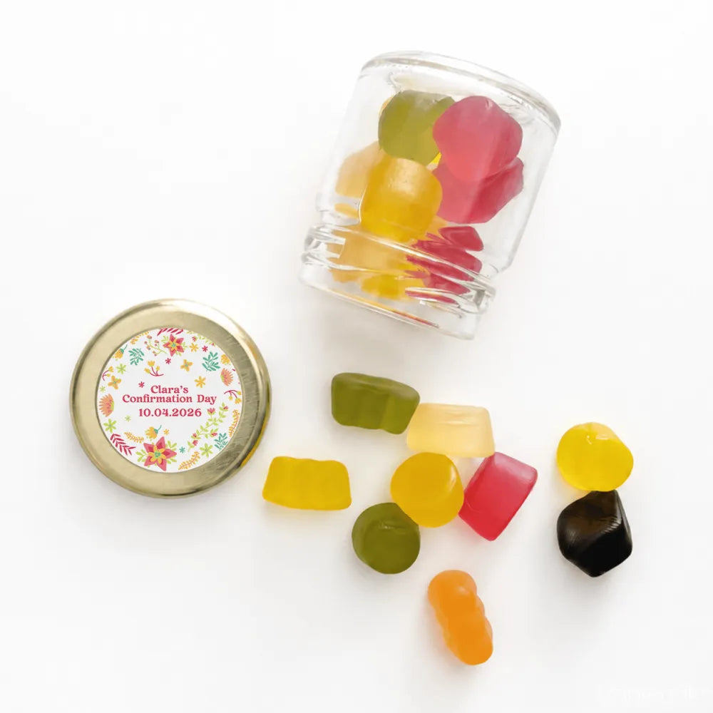 Clear glass jar with a 43mm pale gold twist lid filled with colorful gummies and a personalised sticker printed label wildflower blessing
