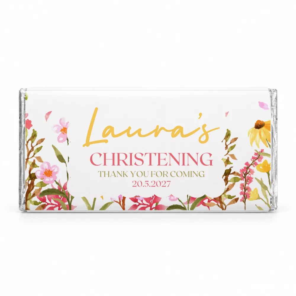 A personalised 40g chocolate bar wrapped in clear foil with pink and yellow floral design for christening thank you
